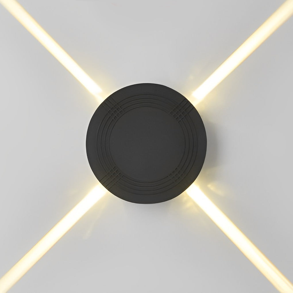 Cross light beams wall sconce with a close-up of the black fixture and light effect.