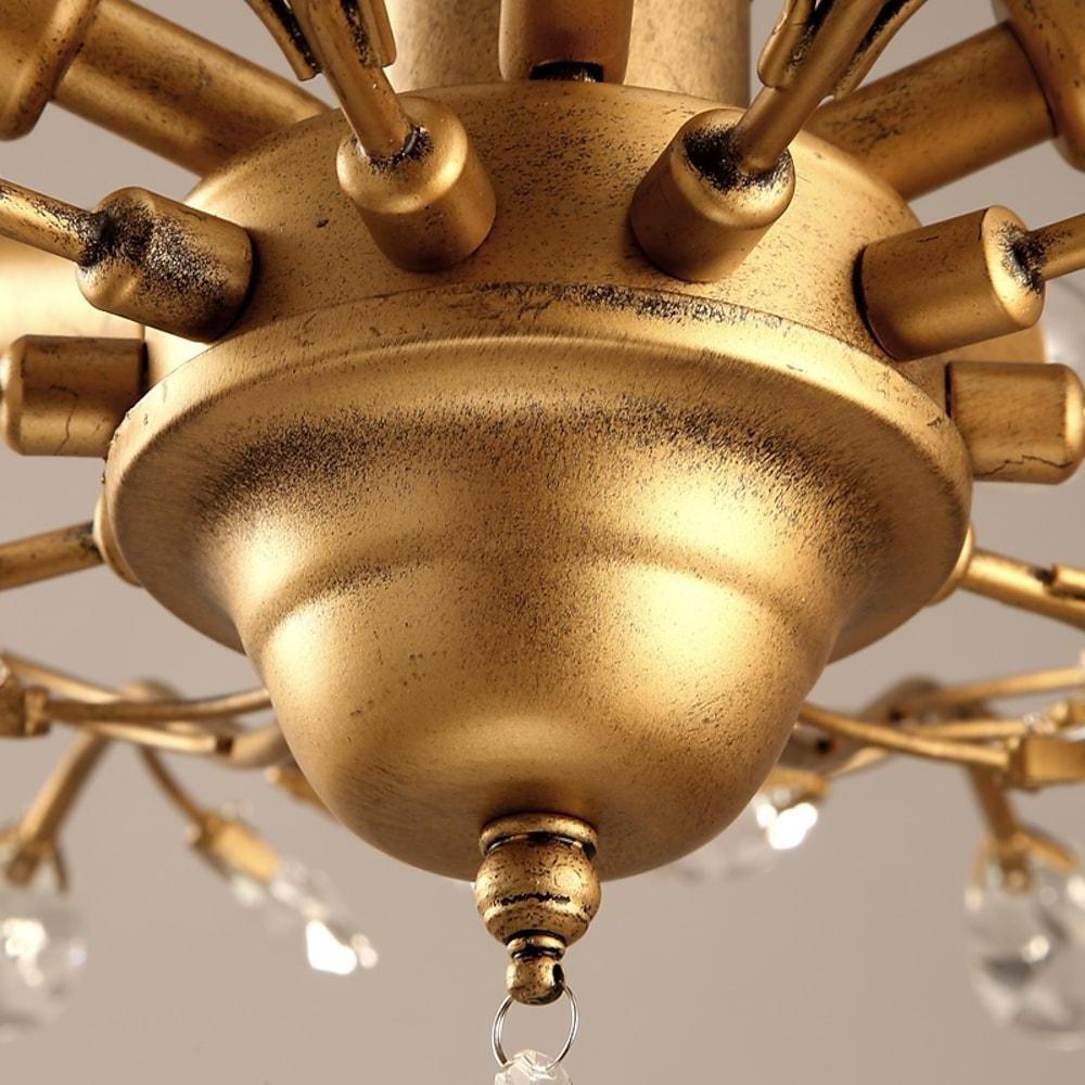 Close-up of crystal branch chandelier canopy and metal structure.