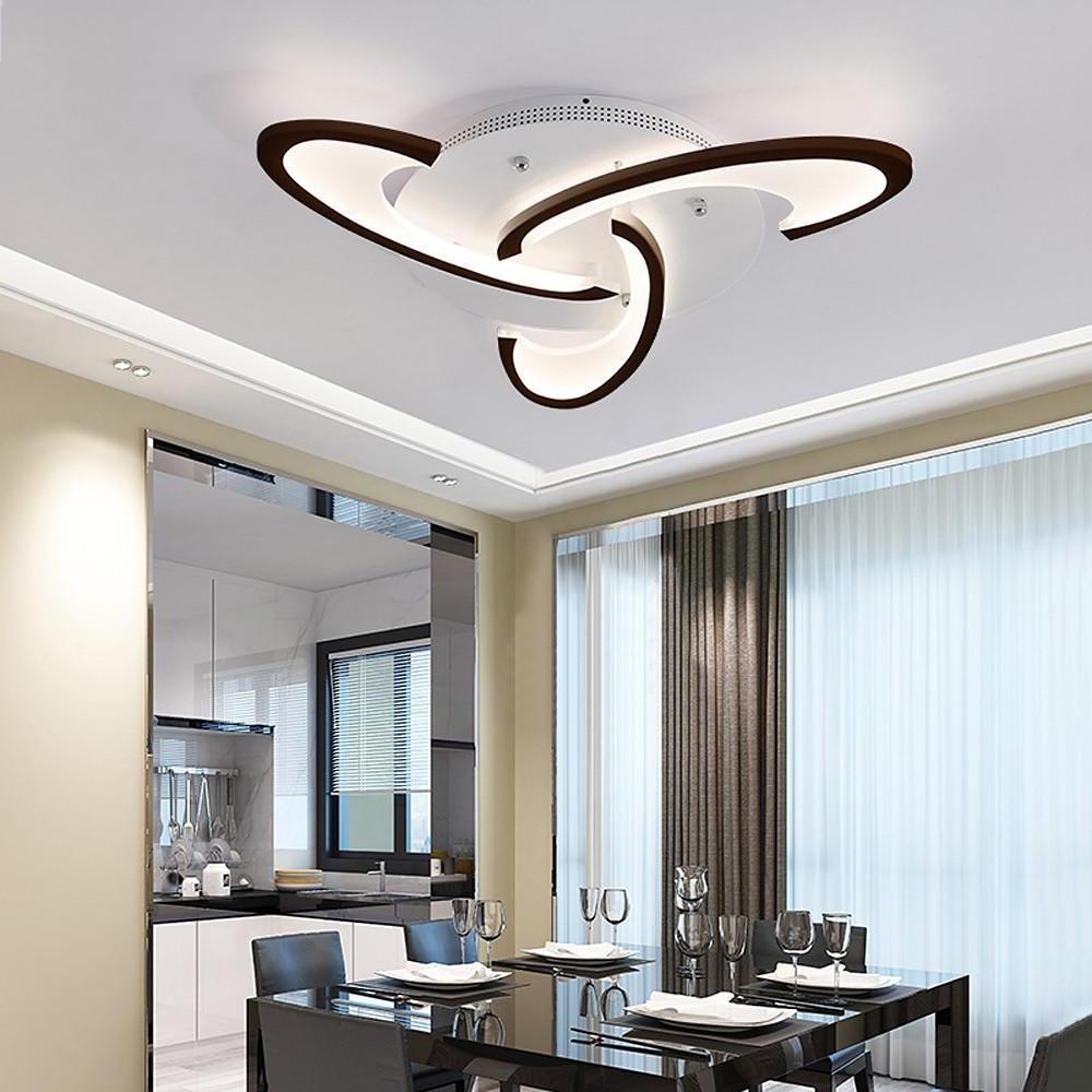 Curved LED ceiling light installed in a modern dining room setting.
