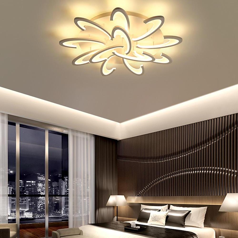 Curved LED ceiling light creating ambient lighting in a luxury bedroom.