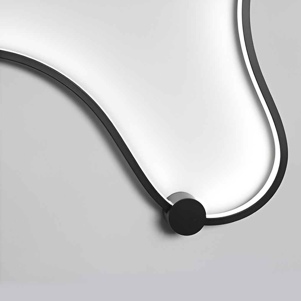 Detail of integrated LED light strip inside a curved wall sconce.