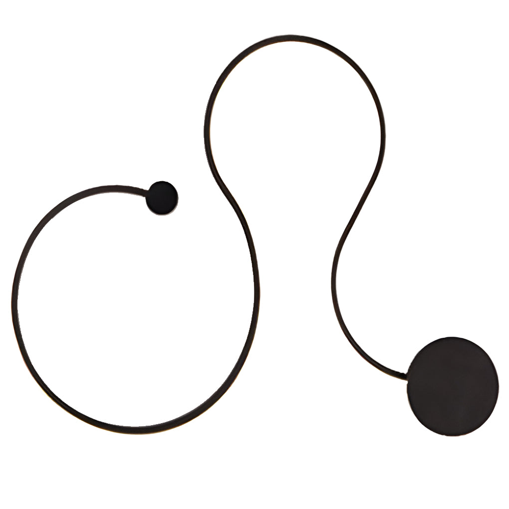 Front view of a black curved wall sconce with a sculptural modern design.