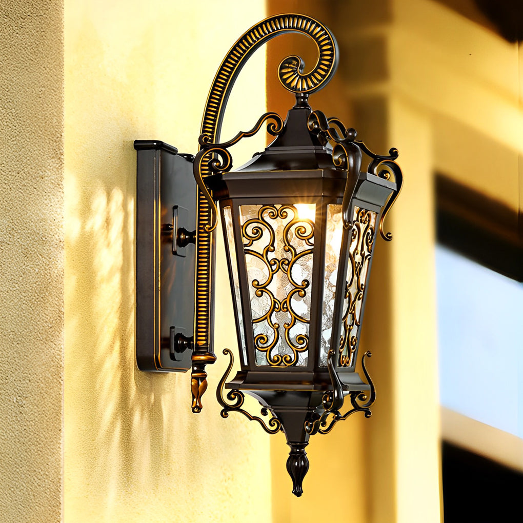 Decorative antique outdoor wall light with curved arm and detailed metalwork illuminating entryway.
