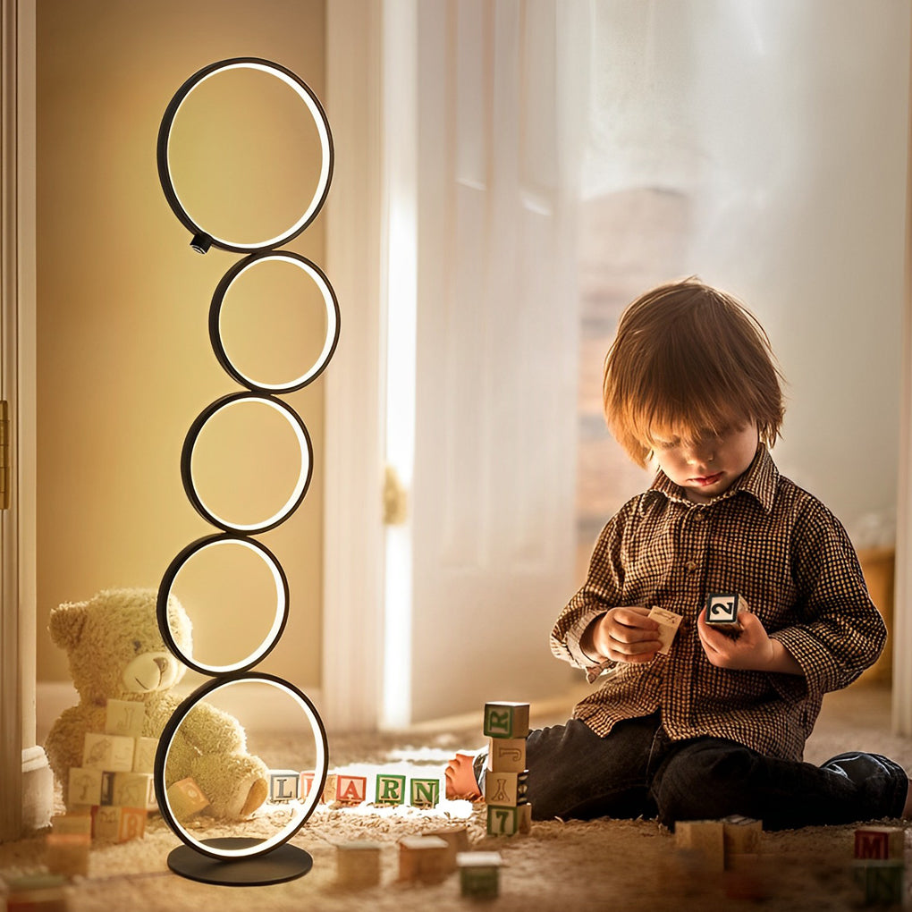 Decorative floor lamps with circular lights, adding a contemporary feel to a child-friendly living space.