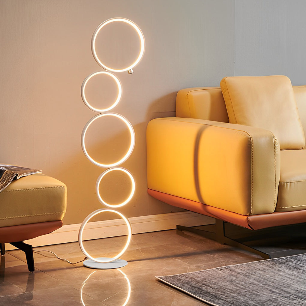 Decorative floor lamps with multiple circular lights, providing ambient illumination in a contemporary space.