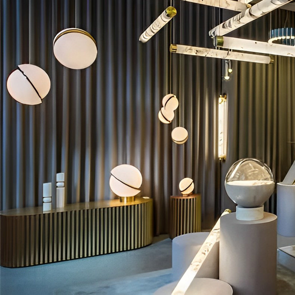A designer showroom displaying various White Spherical Pendant Light styles and lamps.