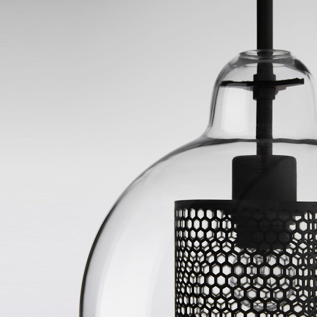 Detail of a Clear Glass Globe Pendant showing the black honeycomb mesh and glass curve.