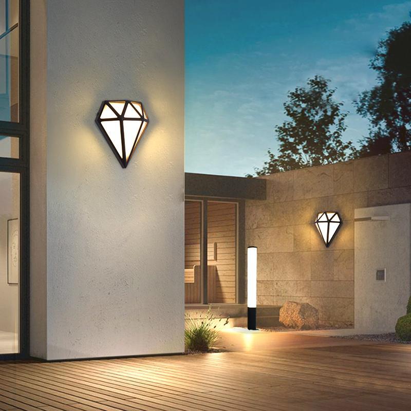 Diamond shape wall light with a sleek design, enhancing a modern exterior wall.