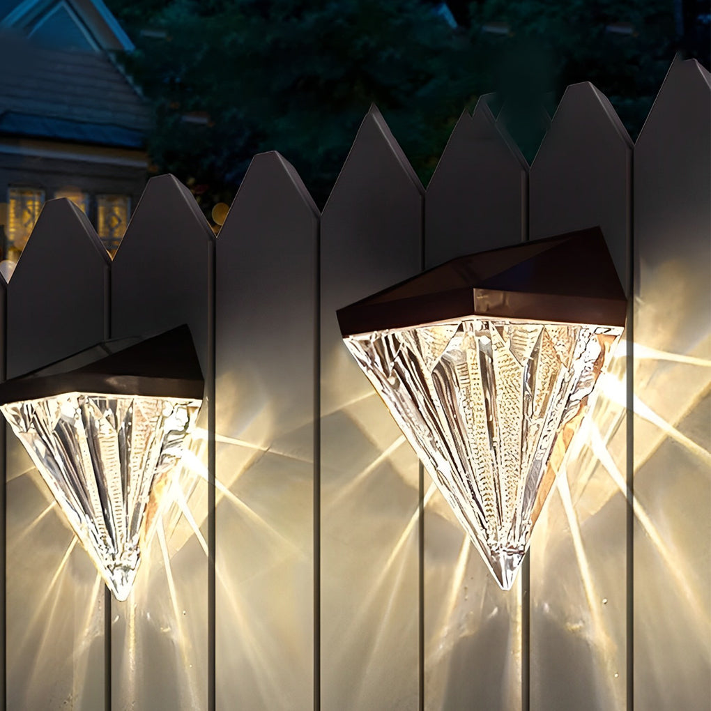 Diamond wall lights enhancing a modern outdoor seating area with warm light.