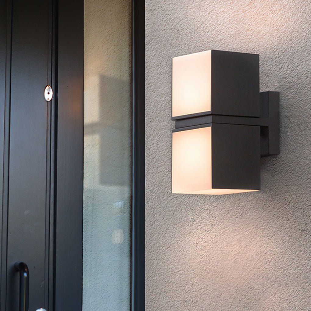 Close-up of a black double head wall light with square shades, designed for sleek outdoor architectural lighting applications.