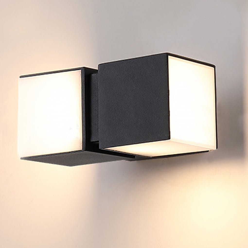 Indoor view of a modern double head wall light with frosted panels, delivering soft ambient lighting on a neutral wall.