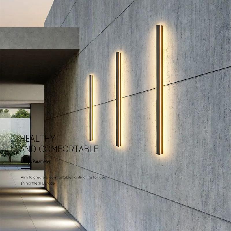 Double long outdoor wall lights mounted on concrete wall, offering symmetrical and stylish outdoor lighting.