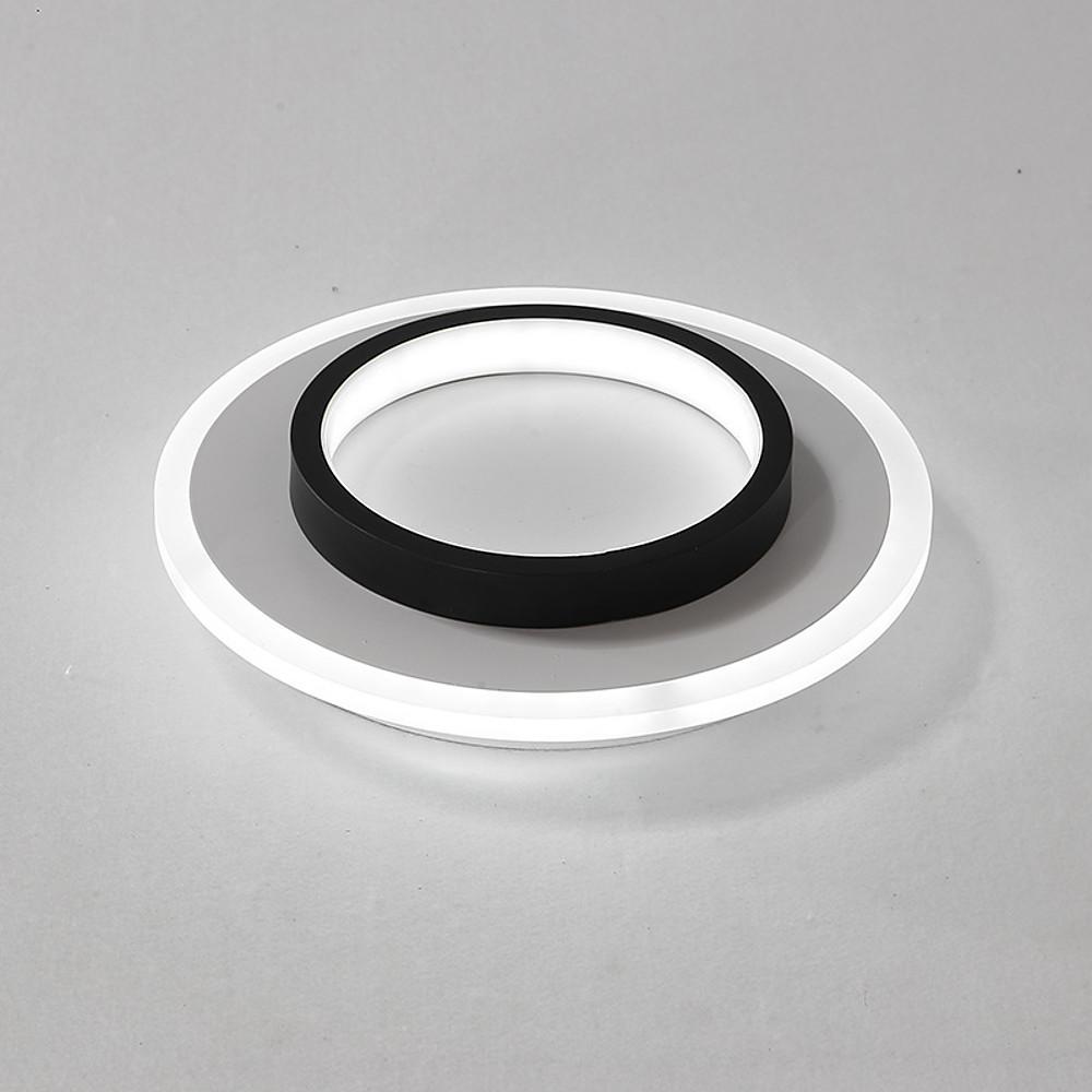 Double ring flush mount illuminating a modern living space with elegant light.