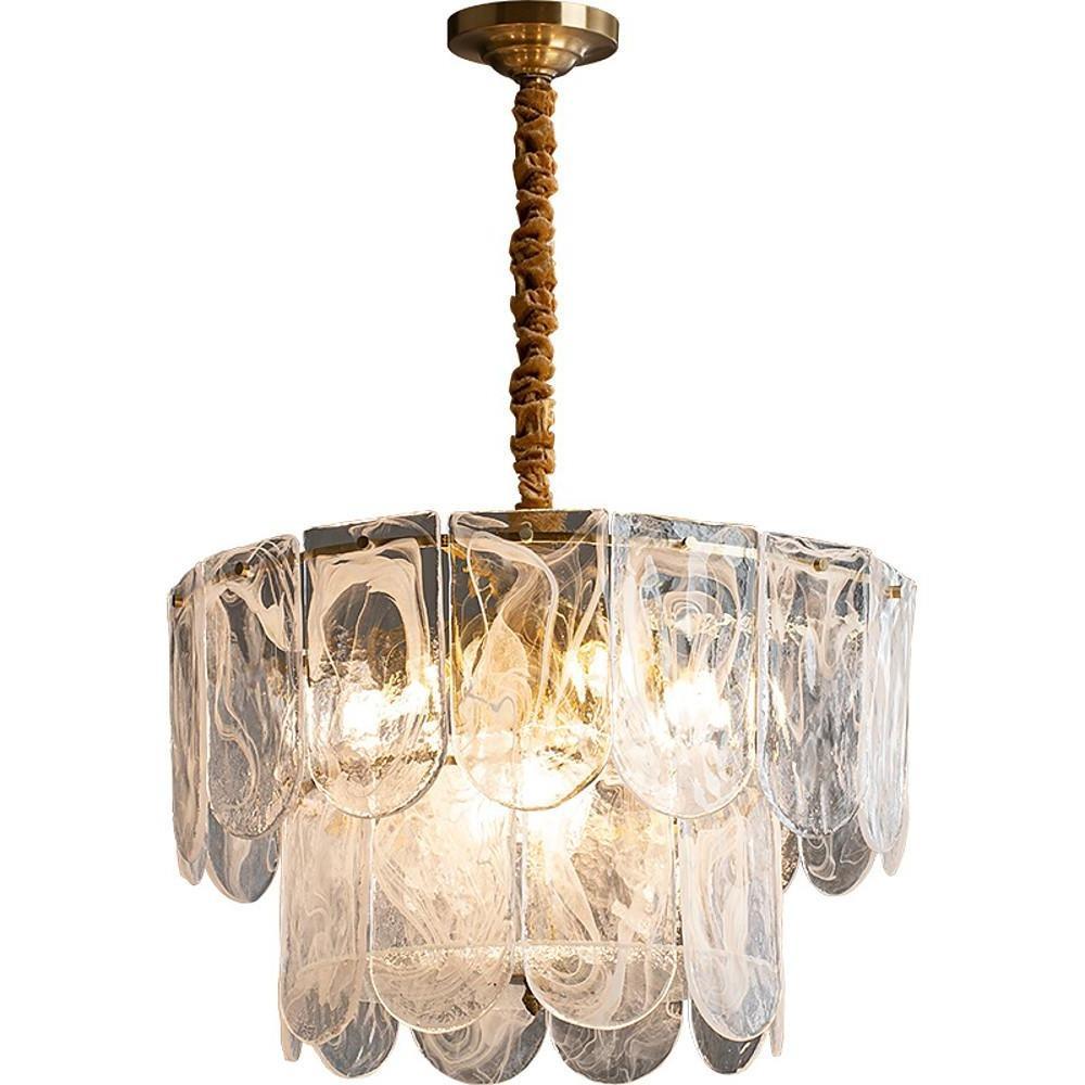 Elegant glass drum chandelier on white background with tiered scalloped panels and gold finish.