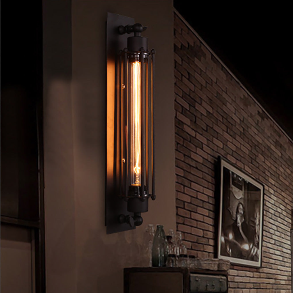 Vintage industrial wall sconce with elongated design, mounted on dark brick wall for stylish and warm glow.