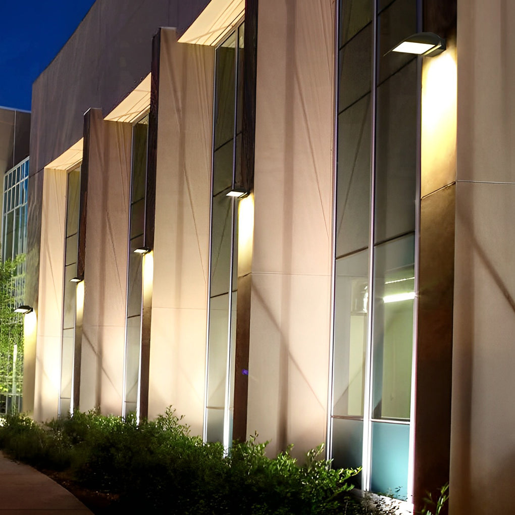 Exterior down wall lights installed along building facade providing uniform exterior illumination.