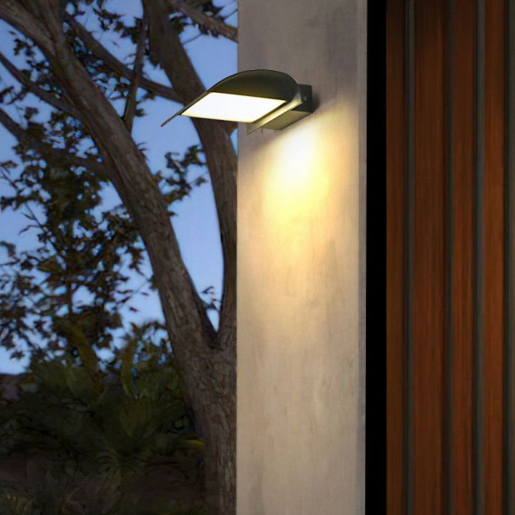 Modern exterior down wall lights installed on outdoor column with trees in background.