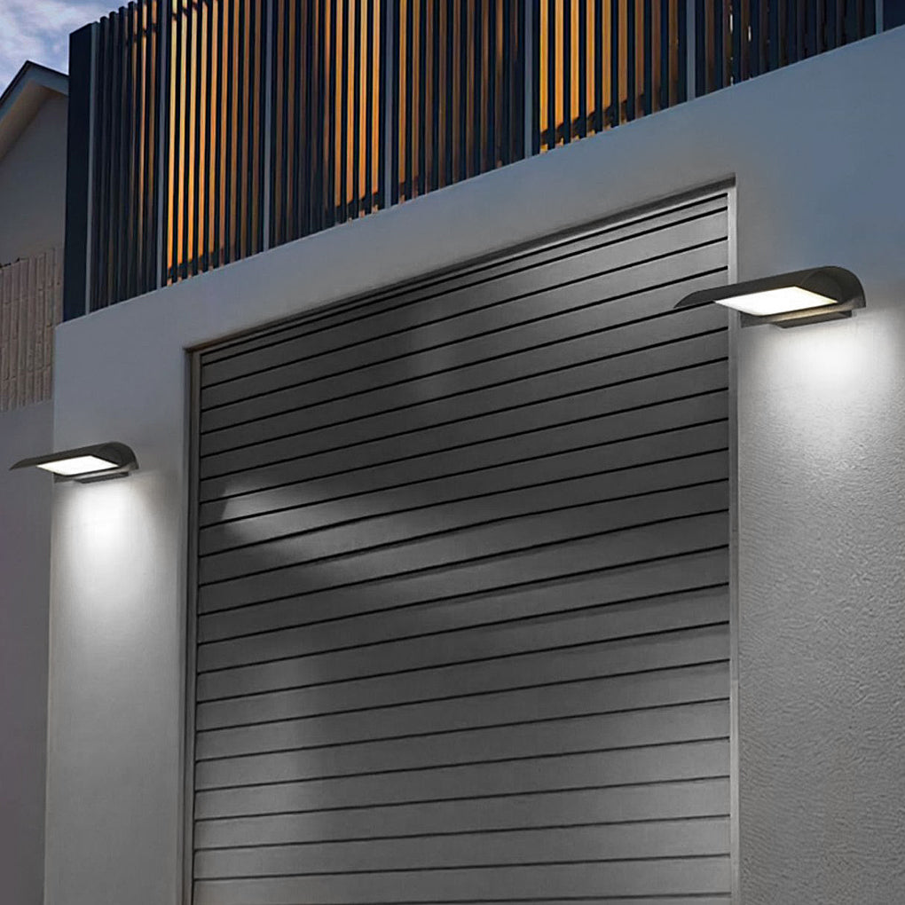 Exterior down wall lights mounted near garage door providing functional and decorative lighting.