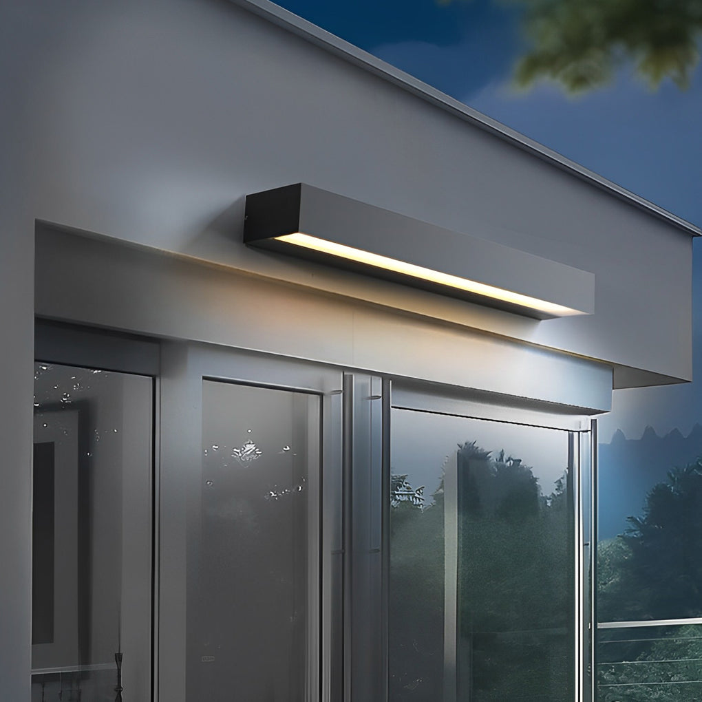 Modern exterior porch light fixtures mounted above glass doors highlighting entryway architecture.