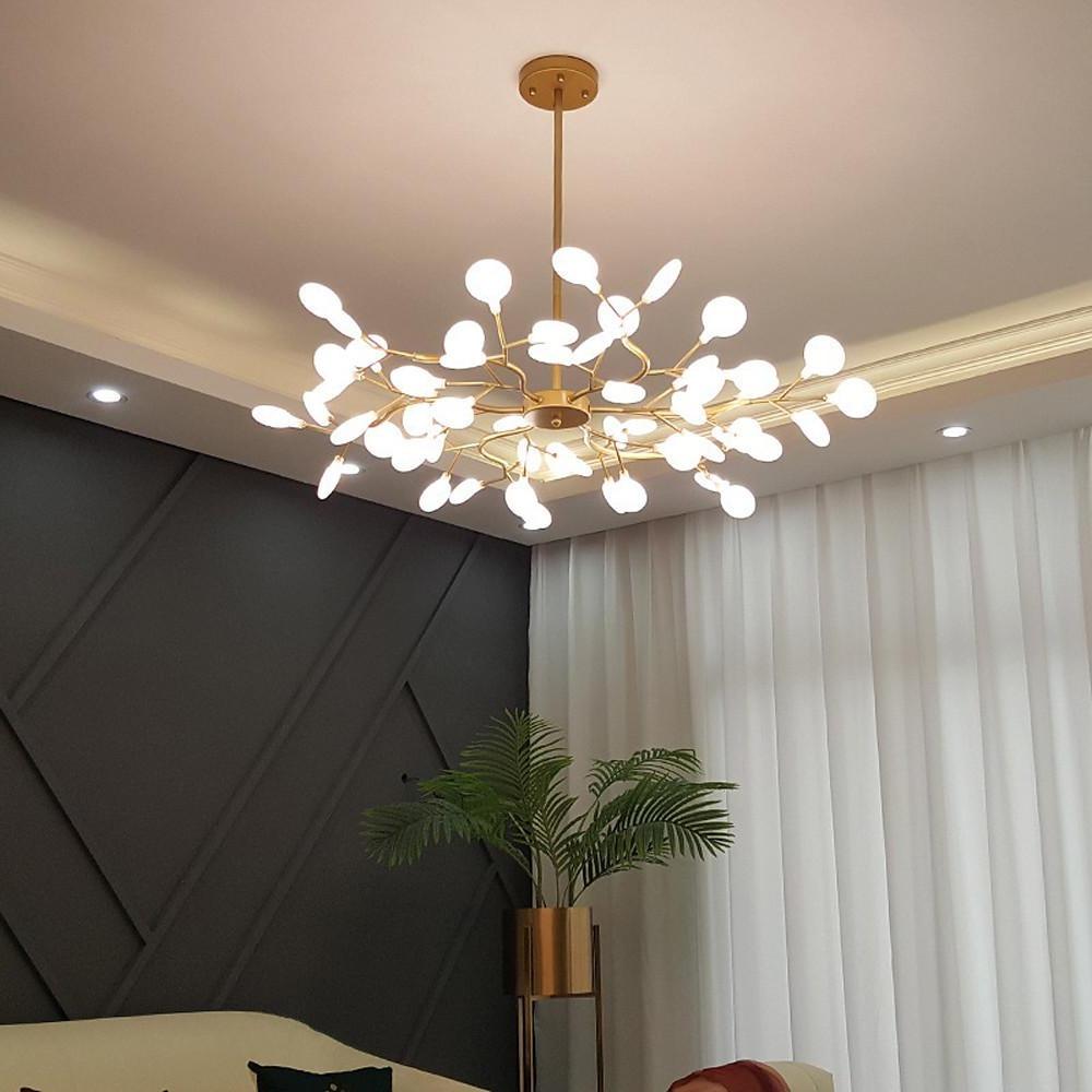 Firefly pendant light with transparent glass shades in living space.