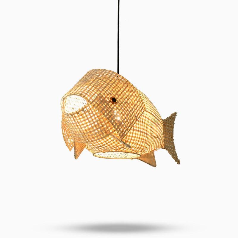 Fish pendant light with a rattan finish, hanging above a minimalist dining table.