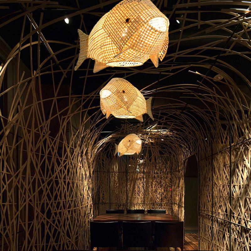 Fish pendant light with a woven design, enhancing a cozy dining area.