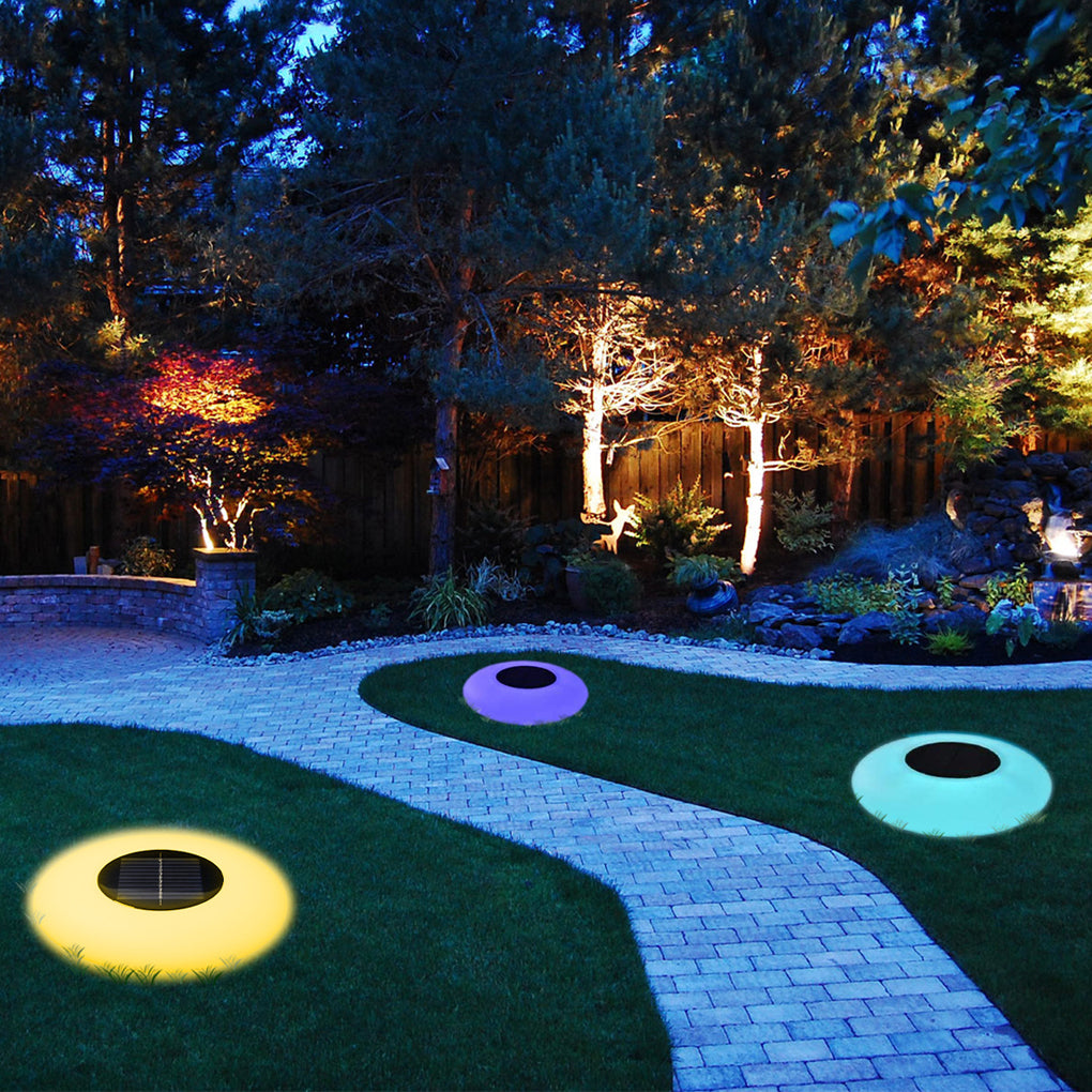 Floating pond lamps decorating outdoor garden pathway