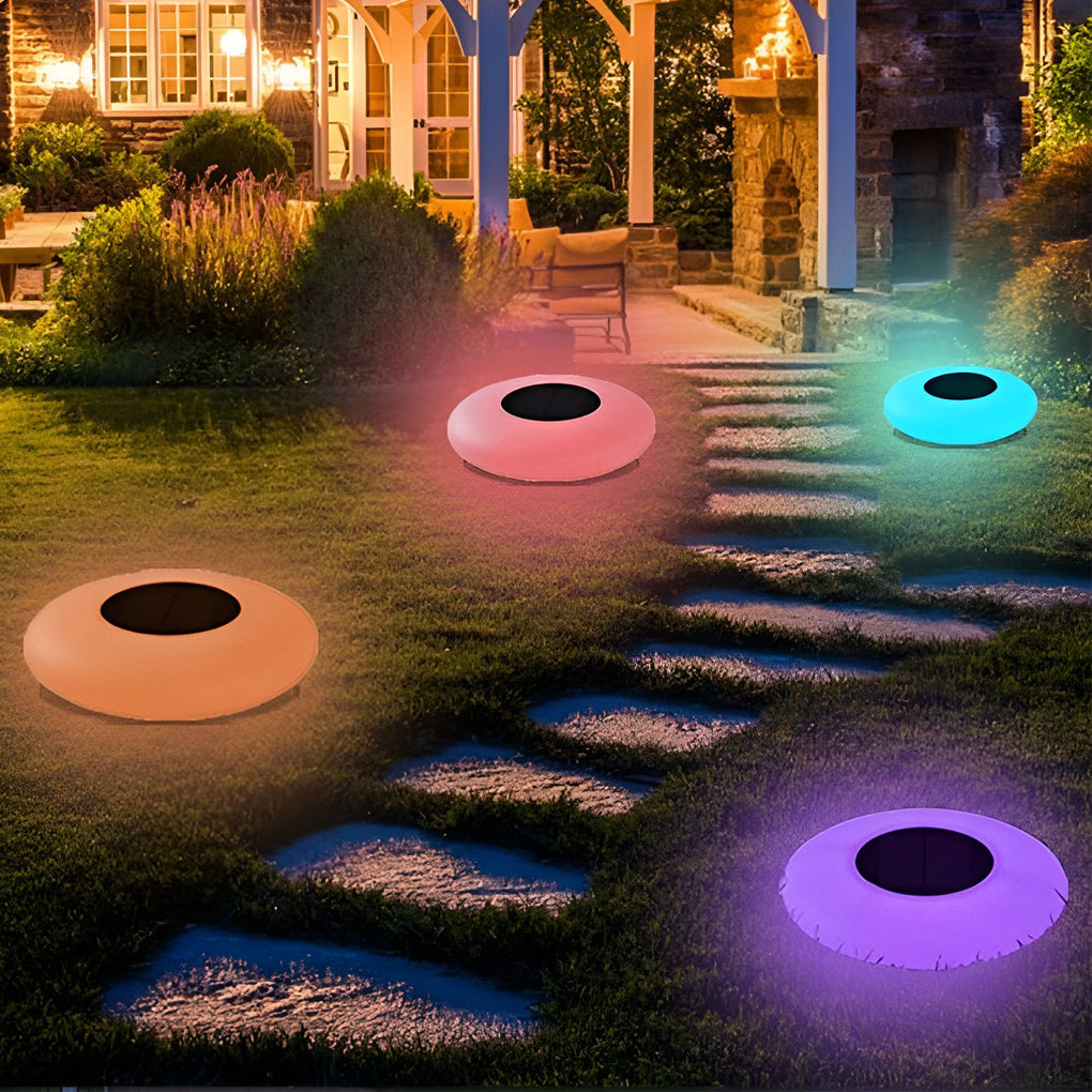 Colorful floating pond lamps along yard steps