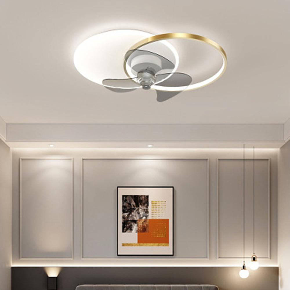 Flush mount black and white ceiling fan with LED light in a modern interior.