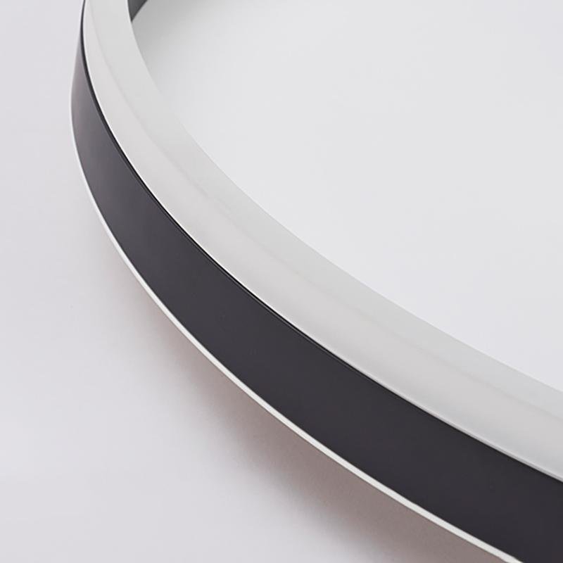 Flush mount ring light with a modern design, providing warm illumination.