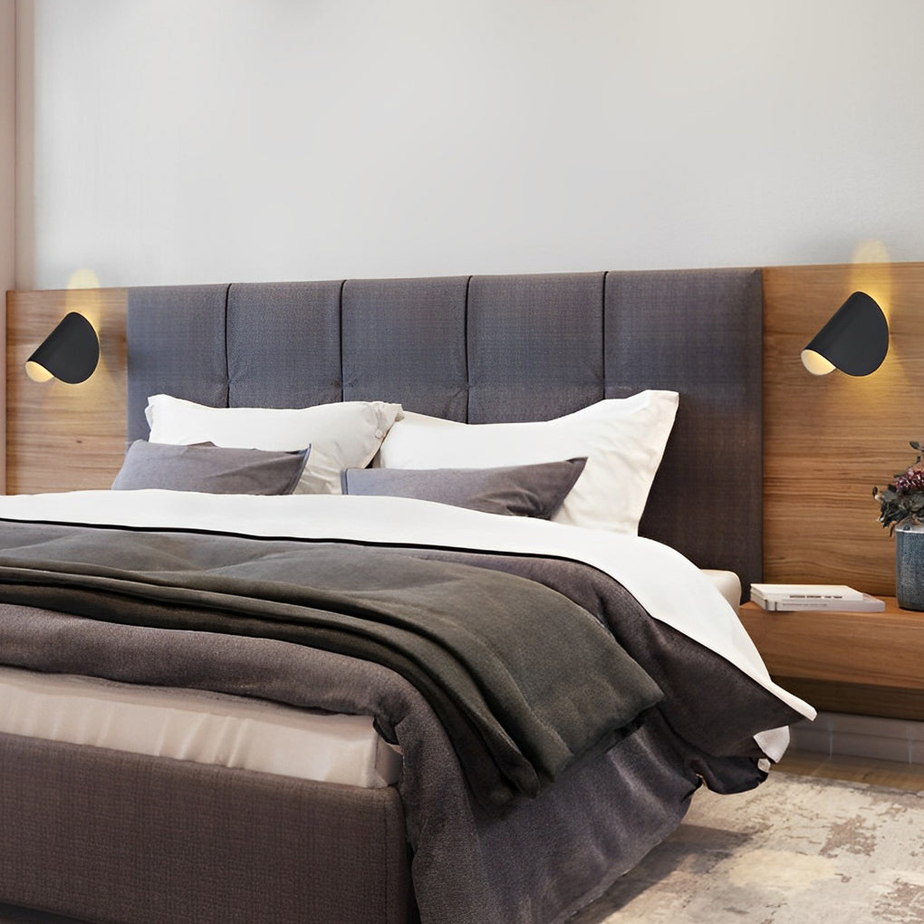 Folding wall sconce with close-up of its sleek design and light output.