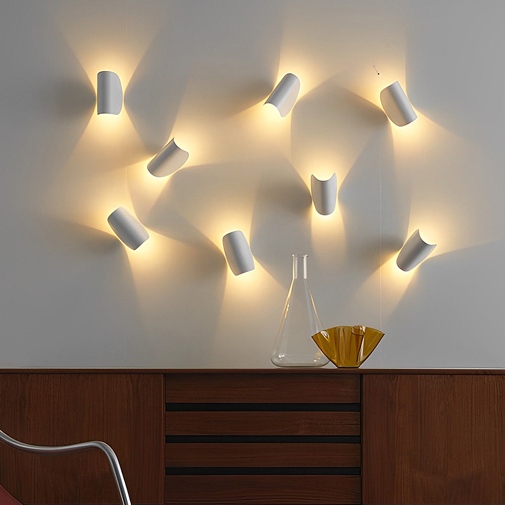 Folding wall sconce with multiple units arranged for modern interior lighting.
