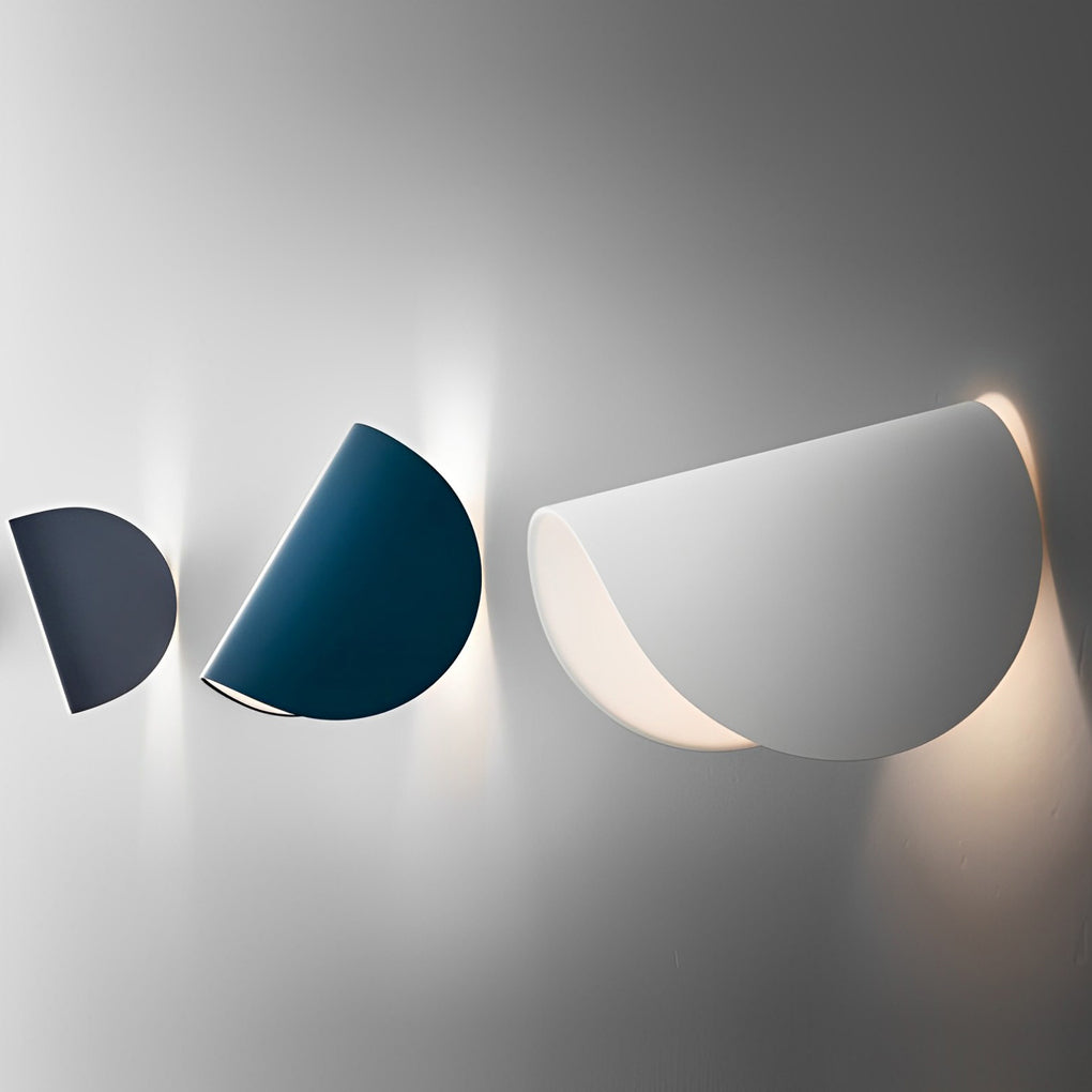 Folding wall sconce with side view showing depth and light diffusion.
