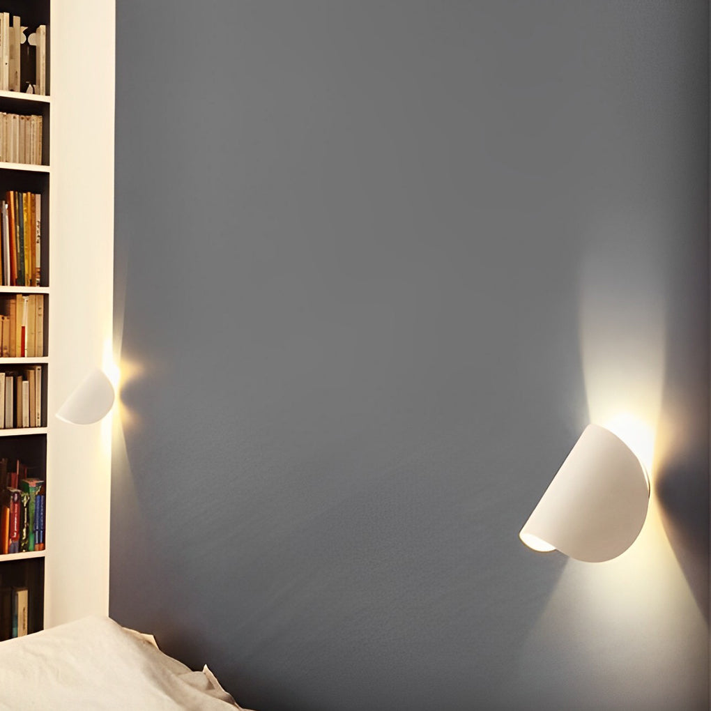 Folding wall sconce with detailed view of its unique folding structure.