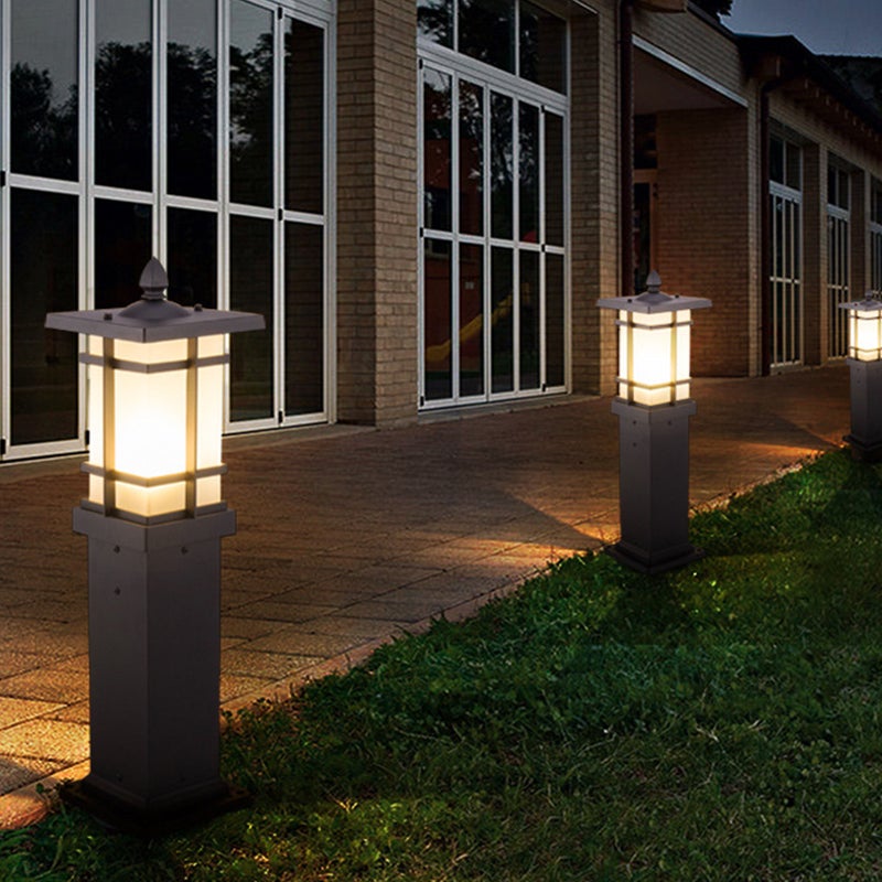 Garden bollard lighting providing elegant illumination along a modern driveway.