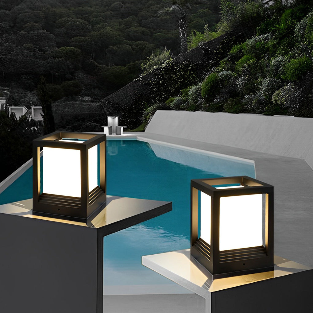 Garden pedestal lights with black frame beside modern pool and lounge area.
