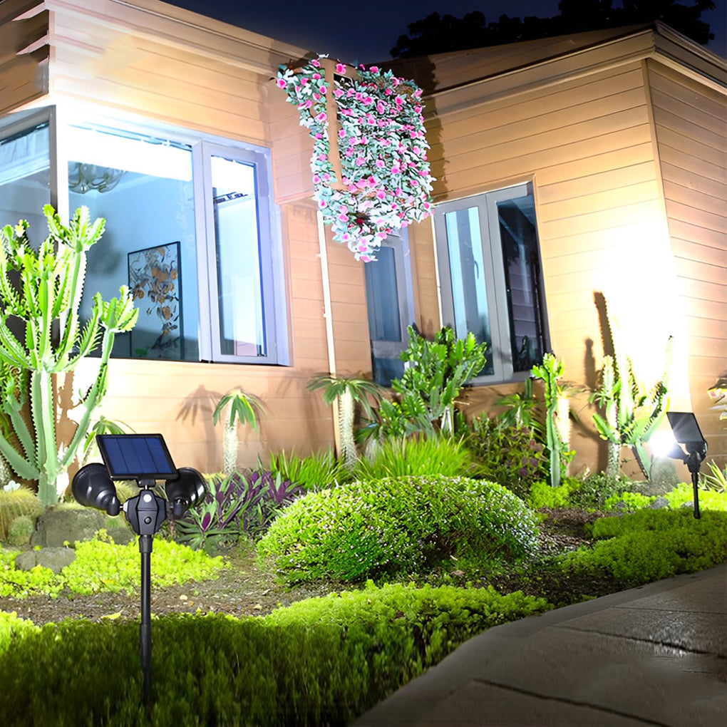 Garden spotlights solar powered illuminating a contemporary garden entrance with ambient light.