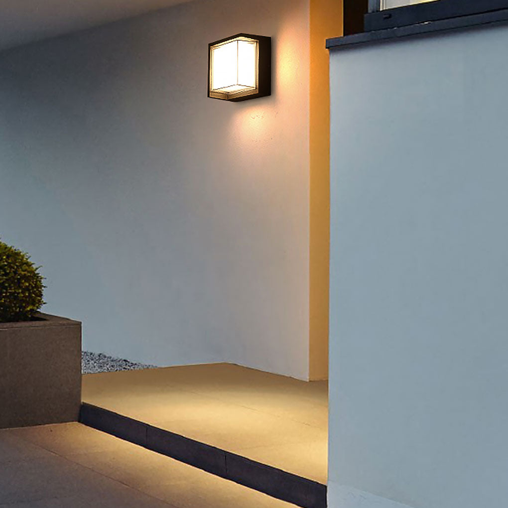 Geometric outdoor sconce providing ambient light in a contemporary outdoor setting.