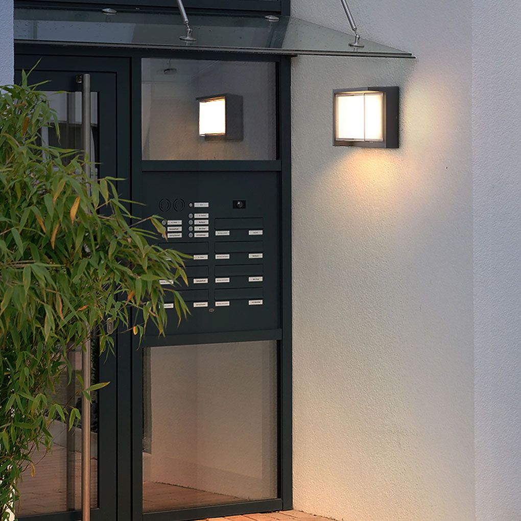 Geometric outdoor sconce enhancing a modern entrance with sleek square design.