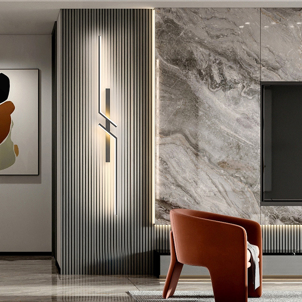 Geometric wall sconce providing ambient light in a stylish bedroom setting.