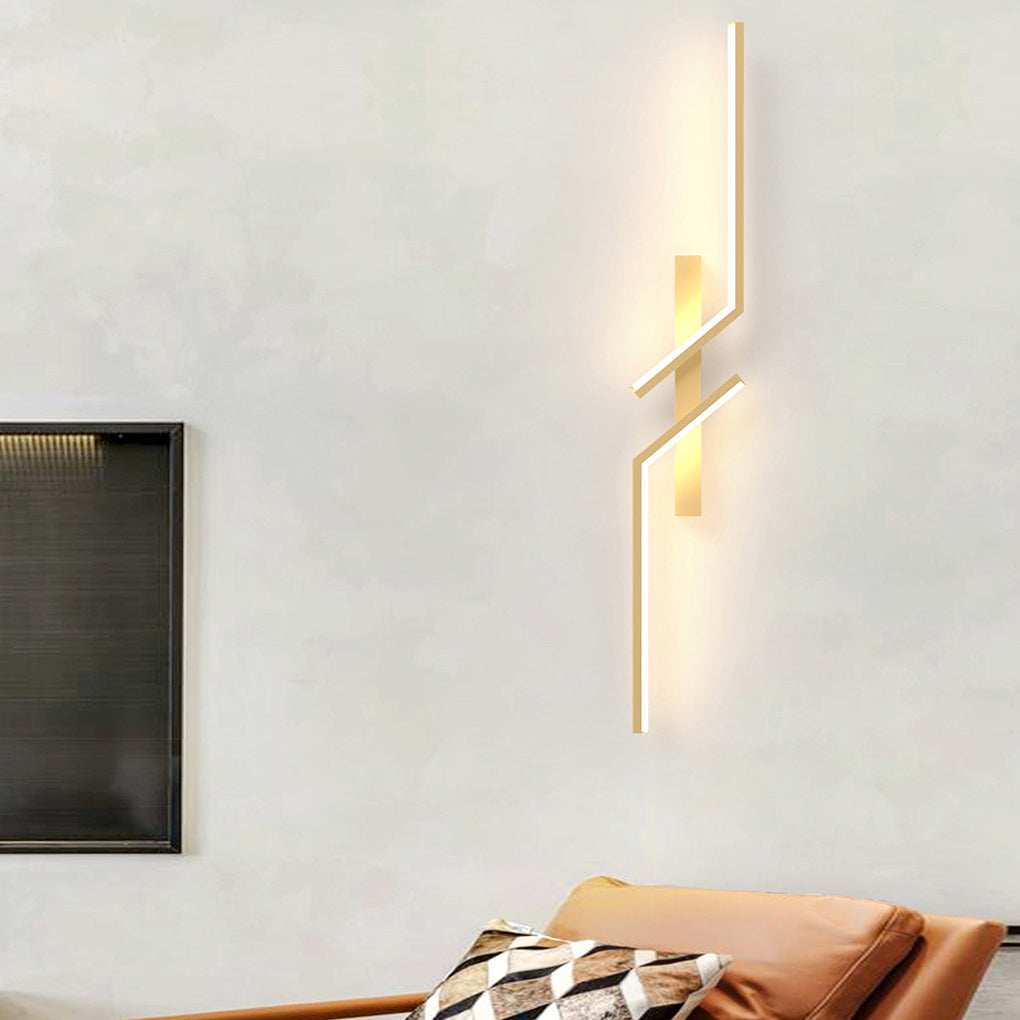 Geometric wall sconce with a unique angular design, illuminating a modern interior.