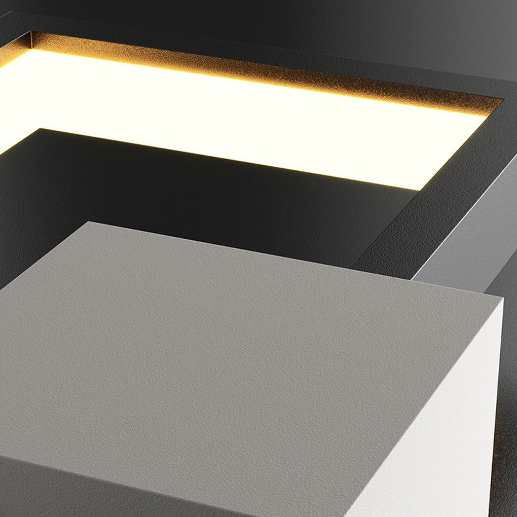 Geometric wall sconce light with black and white contrast for contemporary spaces.