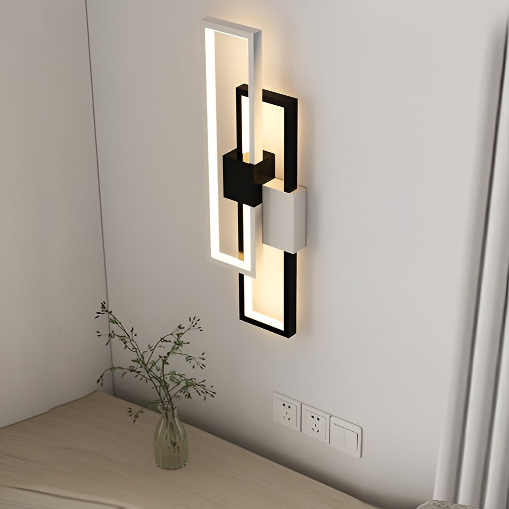 Geometric wall sconce light with close-up of its sleek design and light output.