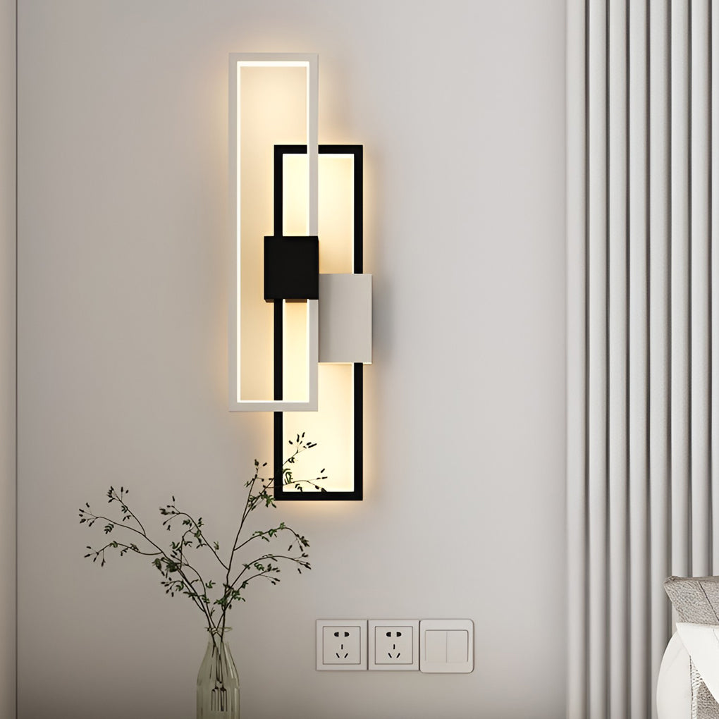 Geometric wall sconce light illuminating a cozy reading nook with directional glow.