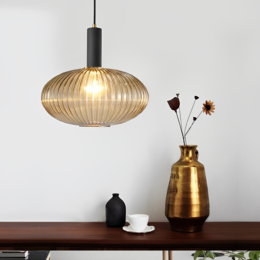 Glass lantern chandelier enhances ceiling aesthetics with clear glass panels and an elegant frame for ambient lighting.