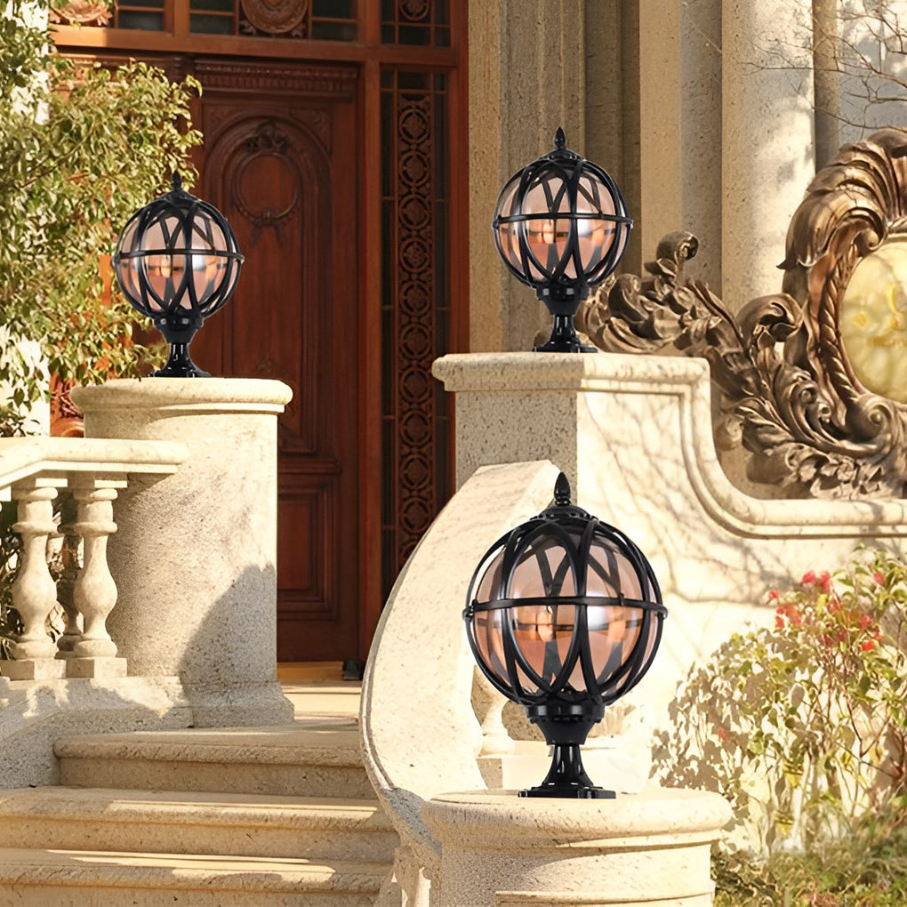 Globe pillar lights with antique bronze finish, enhancing luxury home entrance.