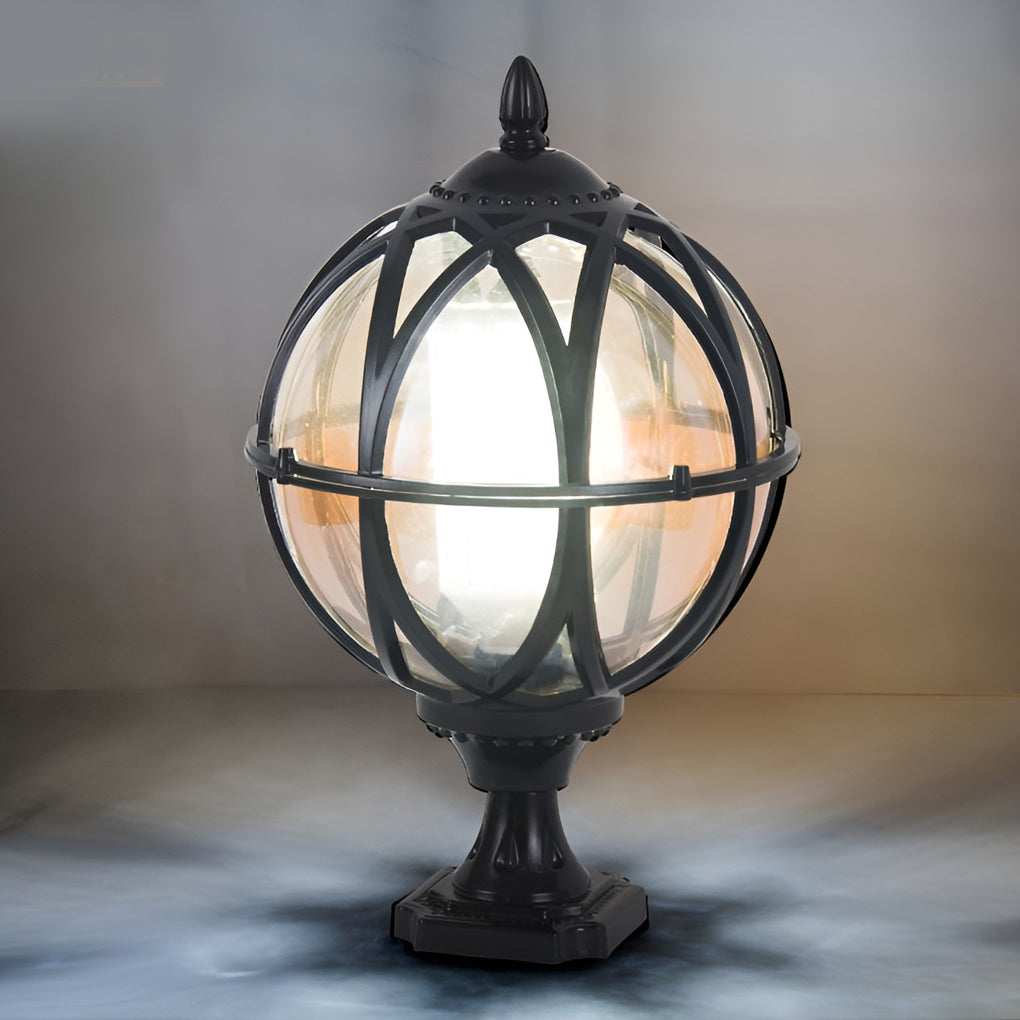 Globe pillar lights with bronze frame, showcasing warm light and detailed craftsmanship.