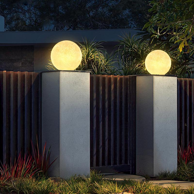 Globe pillar lights used as decorative outdoor wall accents
