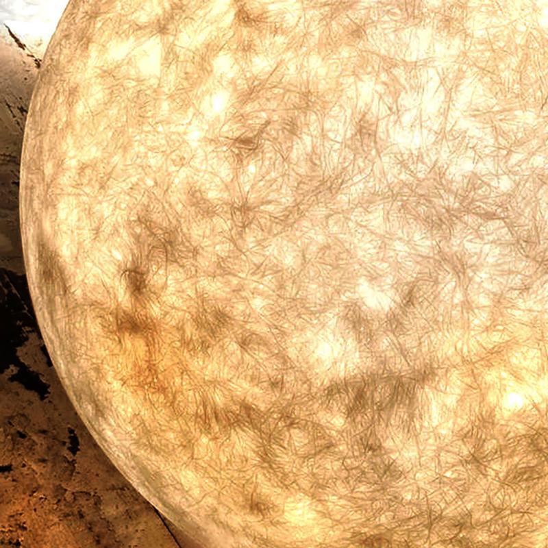 Detail of globe pillar lights emitting a warm ambient glow