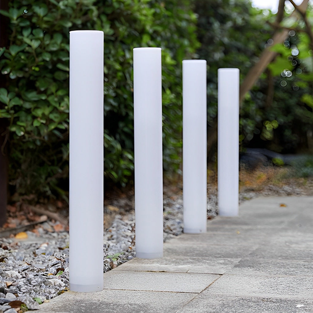Glowing pillar light with detailed view of its solar panel and structure.